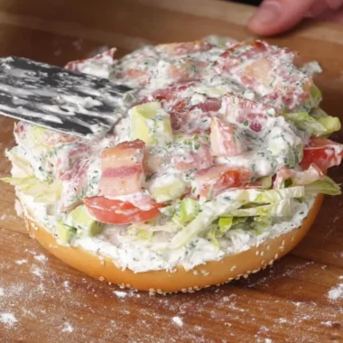 California Chopped BLT Bagel with bacon, lettuce, and tomato on a toasted bagel