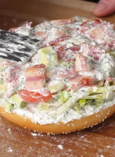 California Chopped BLT Bagel with bacon, lettuce, and tomato on a toasted bagel