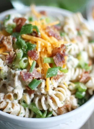 Delicious Cheddar Bacon Ranch Pasta Salad in a bowl with fresh ingredients