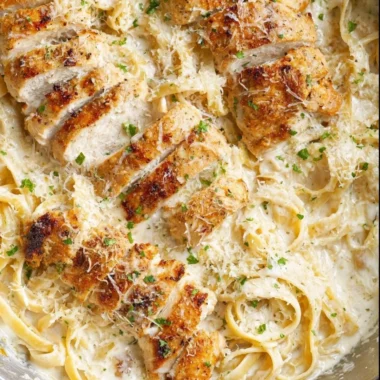 Creamy Chicken Fettuccine Alfredo served in a white bowl