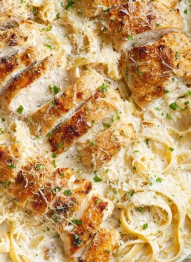 Creamy Chicken Fettuccine Alfredo served in a white bowl
