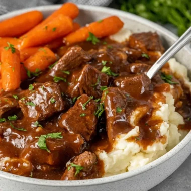 Crock Pot beef tips simmering in rich gravy for a delicious meal