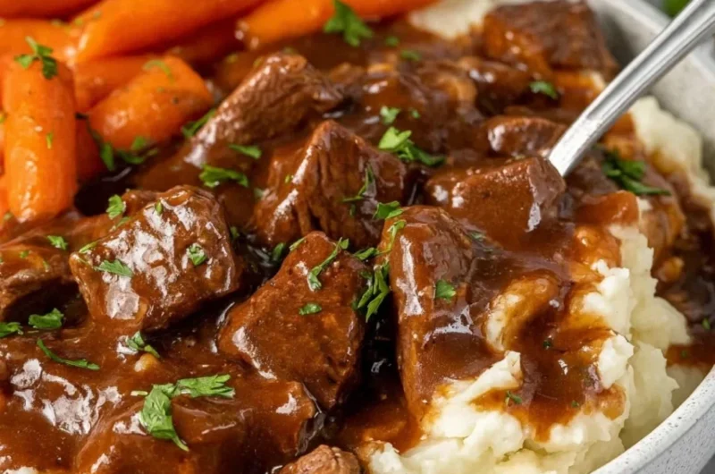Crock Pot beef tips simmering in rich gravy for a delicious meal