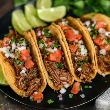 Delicious crock pot street tacos served in soft corn tortillas with toppings