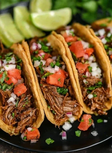 Delicious crock pot street tacos served in soft corn tortillas with toppings