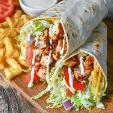 Grilled chicken wrap with chipotle mayo served on a plate