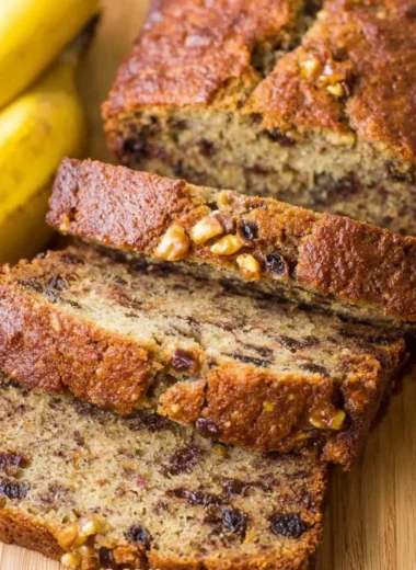 Delicious moist banana nut bread topped with walnuts