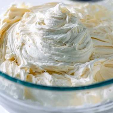 Deliciously creamy American Buttercream frosting on a cake