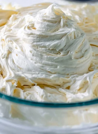 Deliciously creamy American Buttercream frosting on a cake
