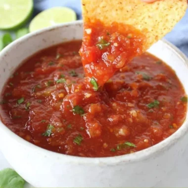 A bowl of delicious homemade salsa made from fresh ingredients.