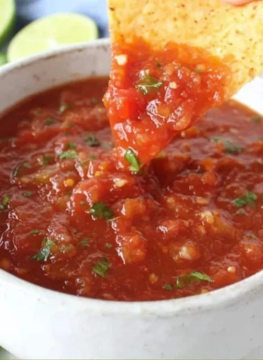 A bowl of delicious homemade salsa made from fresh ingredients.
