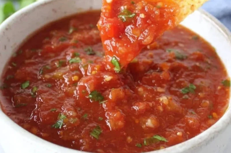 A bowl of delicious homemade salsa made from fresh ingredients.