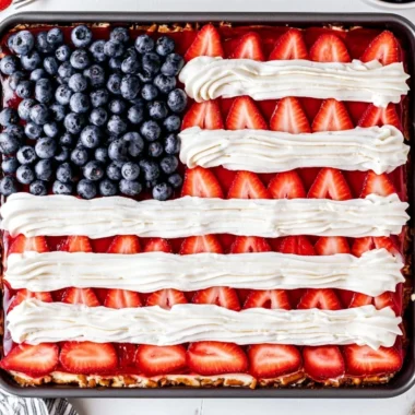 Delicious Strawberry Pretzel Jello Salad in a serving dish with fresh strawberries