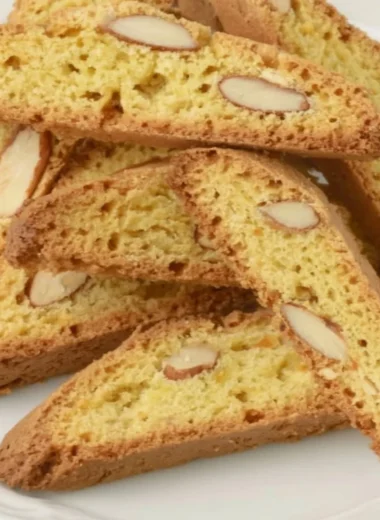 Plate of crispy Cantucci cookies, ideal for dipping in coffee or tea.
