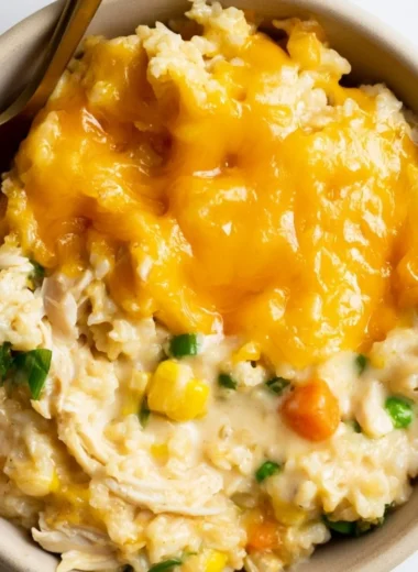 Cheesy chicken and rice casserole served in a baking dish