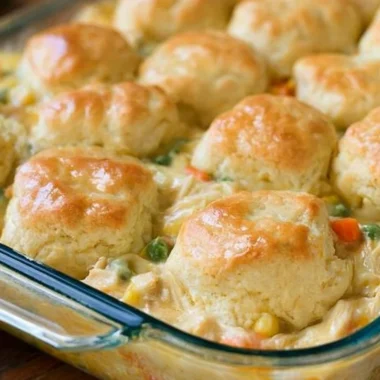 Delicious chicken pot pie topped with flaky biscuits, perfect for cozy dinners.