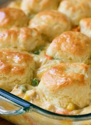 Delicious chicken pot pie topped with flaky biscuits, perfect for cozy dinners.