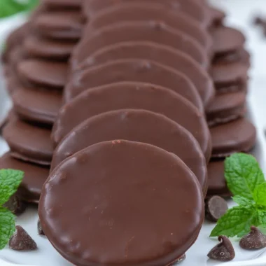 Plate of homemade Thin Mints cookies with mint leaves