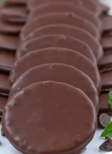 Plate of homemade Thin Mints cookies with mint leaves