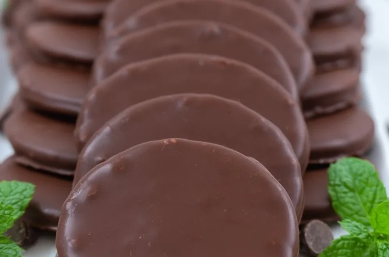 Plate of homemade Thin Mints cookies with mint leaves