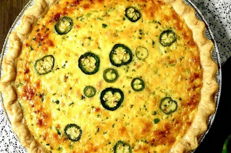 Delicious jalapeno popper quiche topped with cheese and jalapenos
