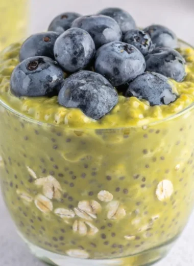 A bowl of Matcha Overnight Oats topped with fruits and nuts, a nutritious breakfast option.