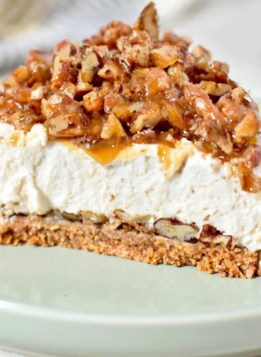 Delicious no-bake Keto Pecan Pie Cheesecake garnished with pecans.