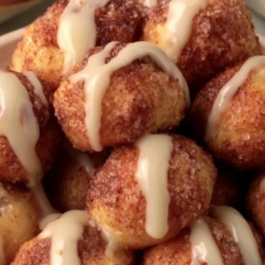 Delicious quick cinnamon roll bites arranged on a plate with icing