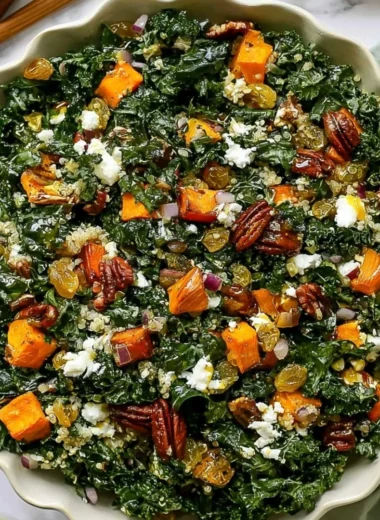 Roasted sweet potato kale salad with vibrant greens and colorful toppings