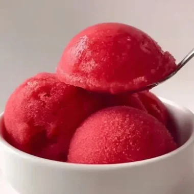 Delicious strawberry sorbet served in a bowl with fresh strawberries