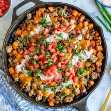 Turkey Sweet Potato Skillet with vegetables in a frying pan
