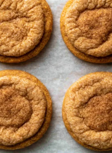 Freshly baked chewy pumpkin cookies on a cooling rack