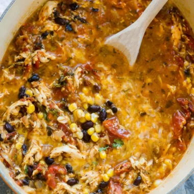 Bowl of easy chicken tortilla soup topped with cilantro and tortilla strips