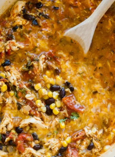 Bowl of easy chicken tortilla soup topped with cilantro and tortilla strips