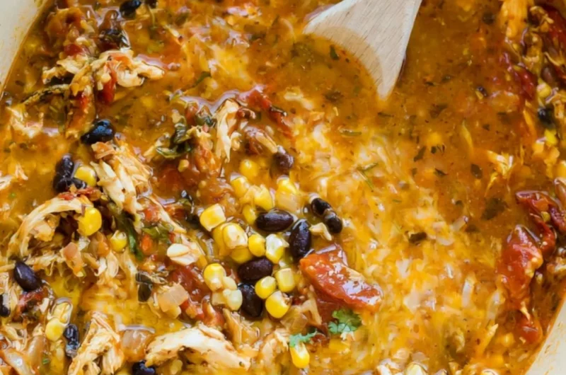 Bowl of easy chicken tortilla soup topped with cilantro and tortilla strips