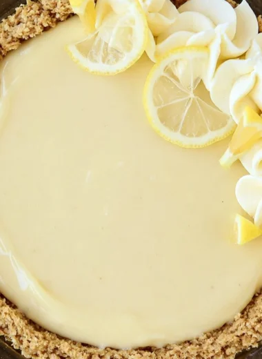 Easy Lemon Cream Pie topped with whipped cream and lemon zest