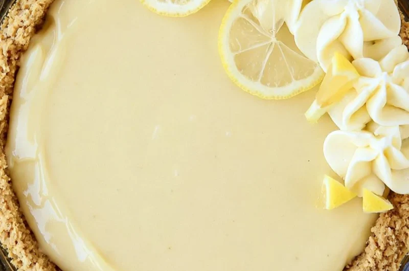 Easy Lemon Cream Pie topped with whipped cream and lemon zest