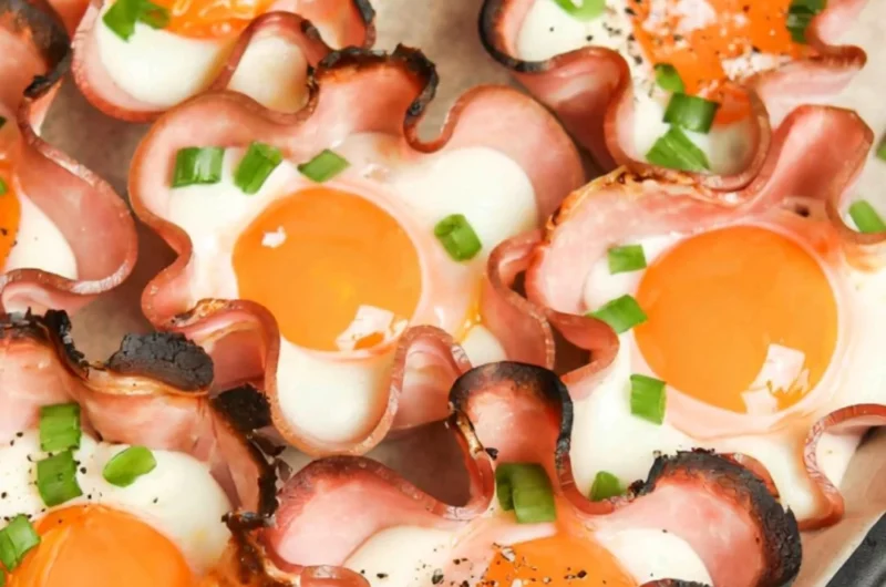 Ham and cheese egg cups baked in muffin tins for a tasty breakfast option