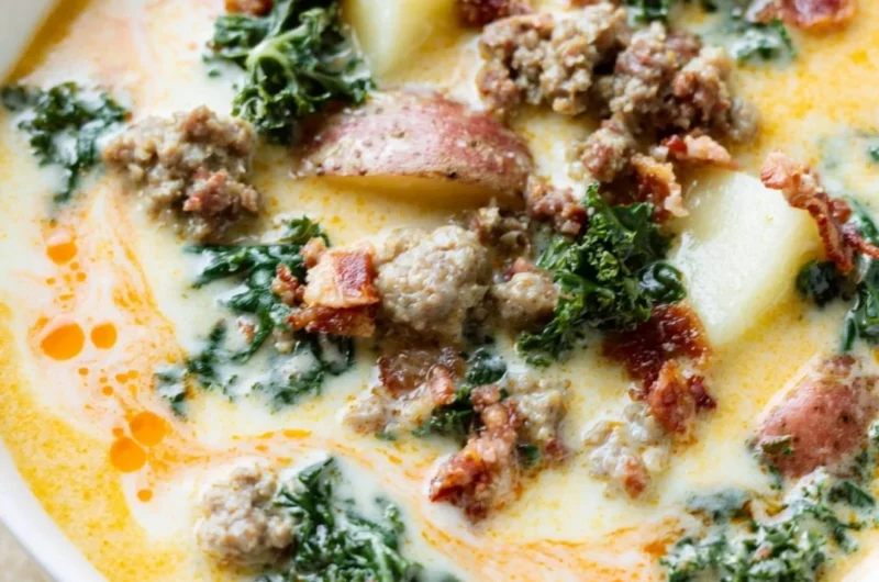 Bowl of Instant Pot Tuscan Soup garnished with fresh herbs and bread croutons