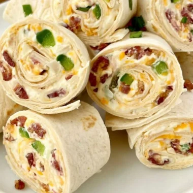 Delicious jalapeno poppers pinwheels appetizer on a platter.