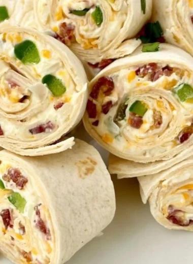 Delicious jalapeno poppers pinwheels appetizer on a platter.