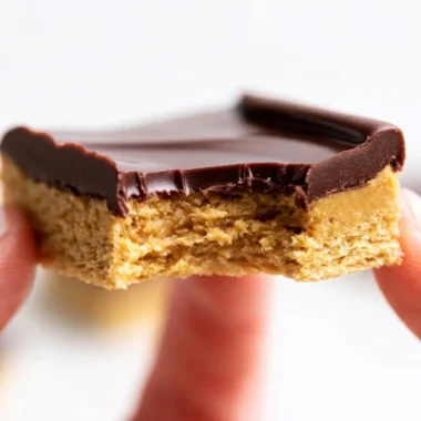 Delicious Lunch Lady Peanut Butter Bars topped with chocolate and a crunchy texture.