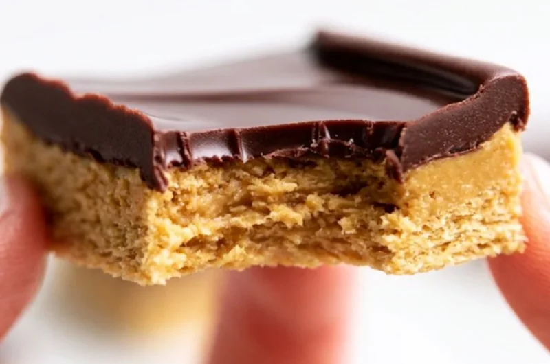 Delicious Lunch Lady Peanut Butter Bars topped with chocolate and a crunchy texture.