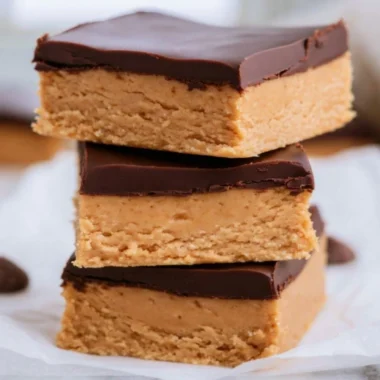 No-bake Peanut Butter Buckeye Bars topped with chocolate.