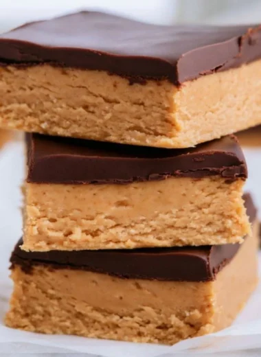 No-bake Peanut Butter Buckeye Bars topped with chocolate.