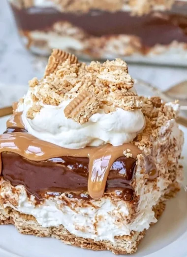 No Bake Peanut Butter Chocolate Lasagna dessert dish with layers of chocolate and peanut butter.