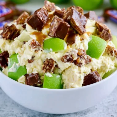 Delicious Snickers Apple Salad with apples, Snickers bars, and creamy dressing