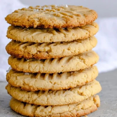 Soft and chewy peanut butter cookies on a baking sheet