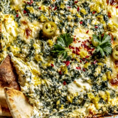 Creamy Spinach and Pepperoncini Baked Feta Dip served with pita bread.