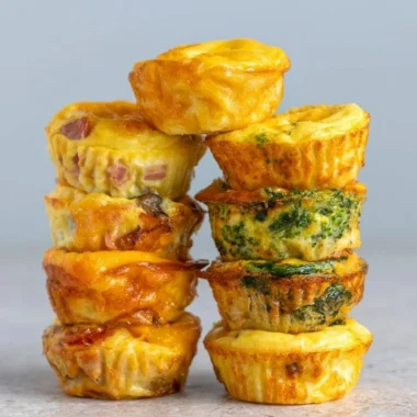 Healthy breakfast egg muffins filled with vegetables and protein.